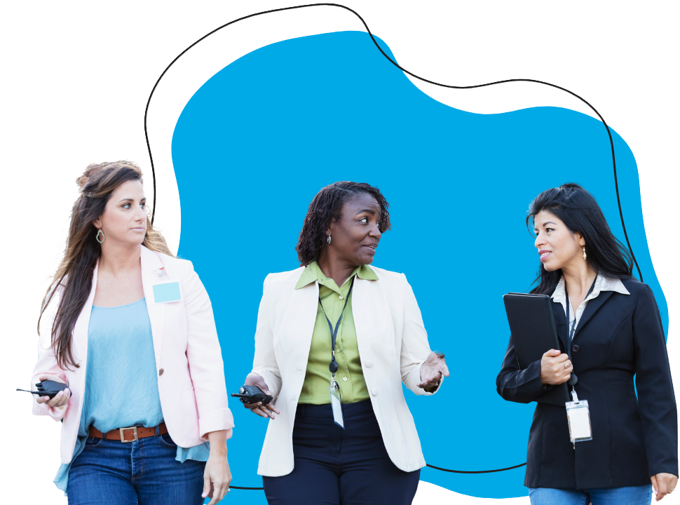 three educators walking and talking